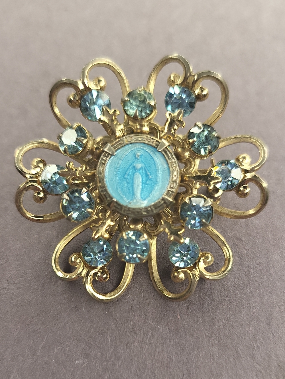 Gold-Tone Blue Crystal Floral Religious Brooch
